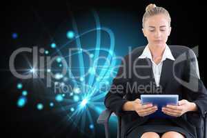 Composite image of businesswoman sitting on swivel chair with ta