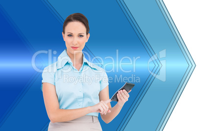 Composite image of serious classy businesswoman using calculator