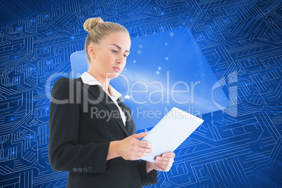 Composite image of businesswoman holding tablet