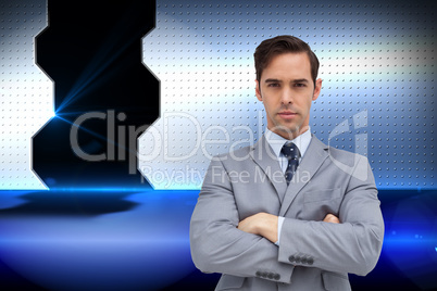 Composite image of young businessman looking at camera