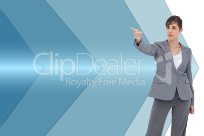 Composite image of young businesswoman pointing to something