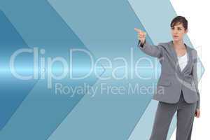 Composite image of young businesswoman pointing to something