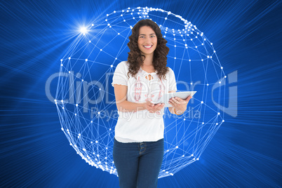 Composite image of smiling casual brunette using her tablet pc