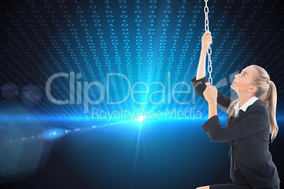 Composite image of businesswoman pulling a chain