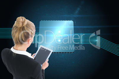 Composite image of businesswoman holding new tablet