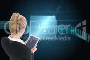 Composite image of businesswoman holding new tablet