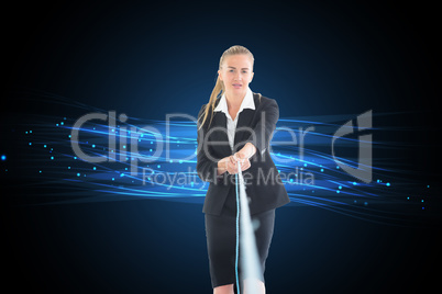 Composite image of businesswoman pulling a rope