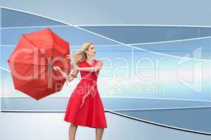 Composite image of elegant blonde holding umbrella