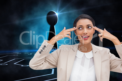 Composite image of confident young businesswoman pointing her he