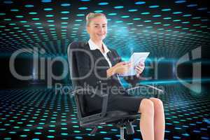 Composite image of businesswoman sitting on swivel chair with ta