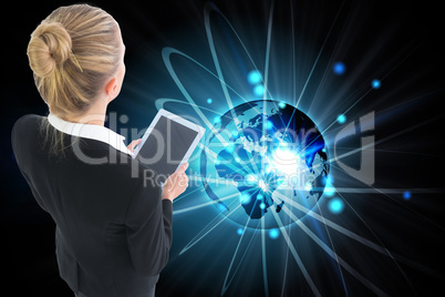 Composite image of businesswoman holding new tablet