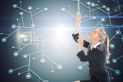 Composite image of businesswoman pulling a chain