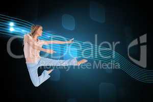 Composite image of woman doing dance pose