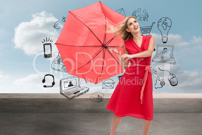 Composite image of elegant blonde holding umbrella