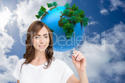 Composite image of smiling businesswoman holding marker