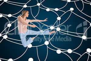 Composite image of woman doing dance pose