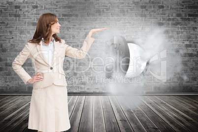 Composite image of smiling businesswoman raising her hand