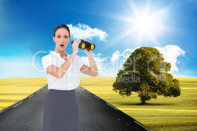 Composite image of astonished elegant businesswoman holding bino