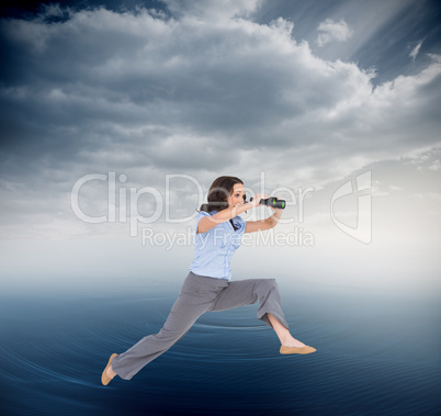 Composite image of cheerful classy businesswoman jumping while h