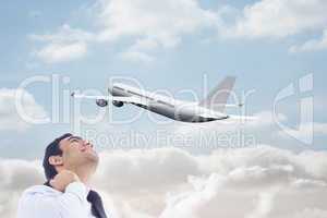 Composite image of smiling businessman standing