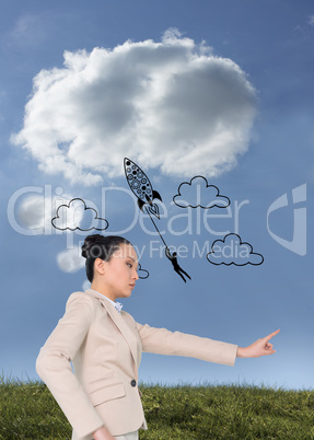 Composite image of unsmiling asian businesswoman pointing