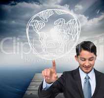 Composite image of smiling asian businessman pointing