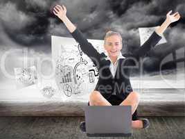 Composite image of businesswoman sitting in front of laptop with