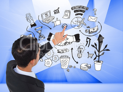 Composite image of asian businessman pointing