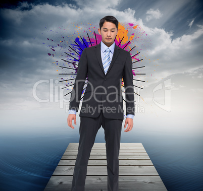 Composite image of serious asian businessman