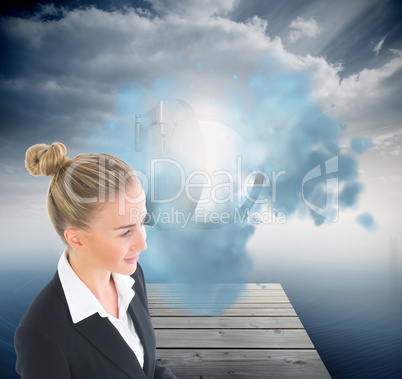 Composite image of businesswoman holding tablet