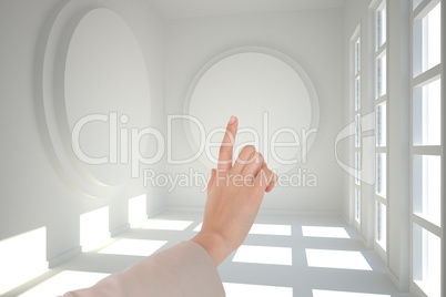 Composite image of businesswoman pointing