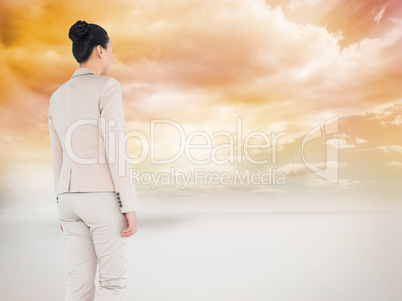 Composite image of asian businesswoman walking