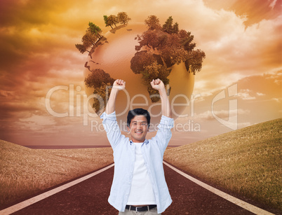 Composite image of cheering male with arms up