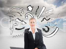 Composite image of businesswoman using laptop