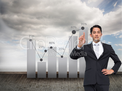 Composite image of unsmiling asian businessman pointing