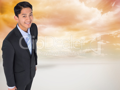 Composite image of smiling asian businessman