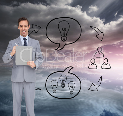Composite image of happy businessman holding a clipboard