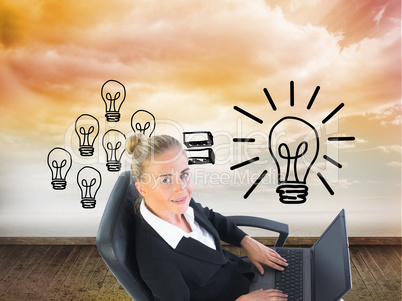 Composite image of businesswoman sitting on swivel chair with la Composite image of businesswoman sitting on swivel chair with la