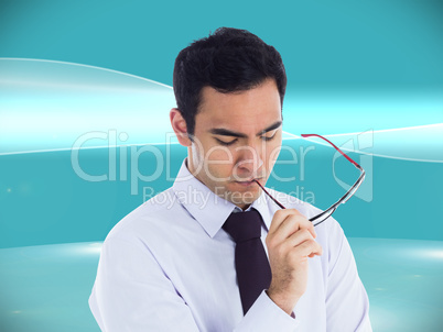 Composite image of unsmiling businessman holding glasses