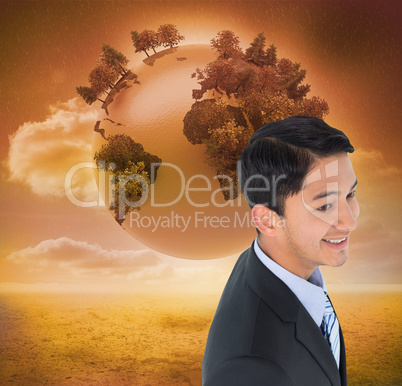 Composite image of smiling asian businessman