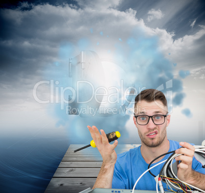 Composite image of portrait of confused it professional with scr