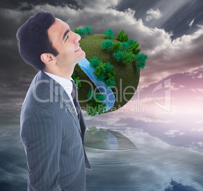 Composite image of smiling businessman standing