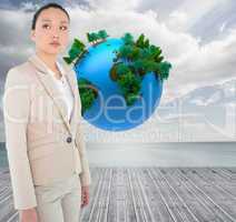 Composite image of unsmiling asian businesswoman