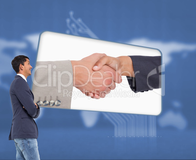 Composite image of smiling casual businessman with arms crossed