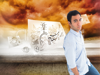 Composite image of unsmiling casual man standing