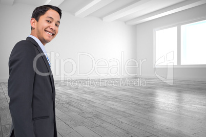 Composite image of smiling asian businessman