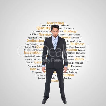 Composite image of serious asian businessman