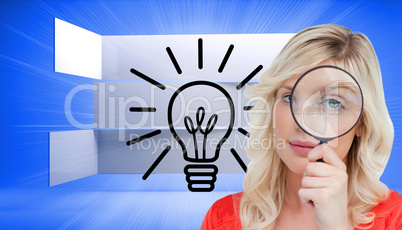 Composite image of fair-haired woman looking through a magnifyin