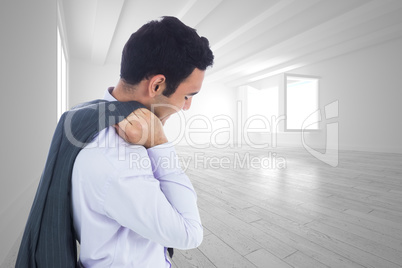 Composite image of smiling businessman standing