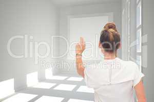 Composite image of businesswoman touching something